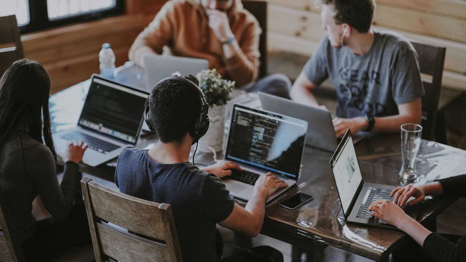 Kabim Tech engineers collaborating on product delivery in a modern workspace