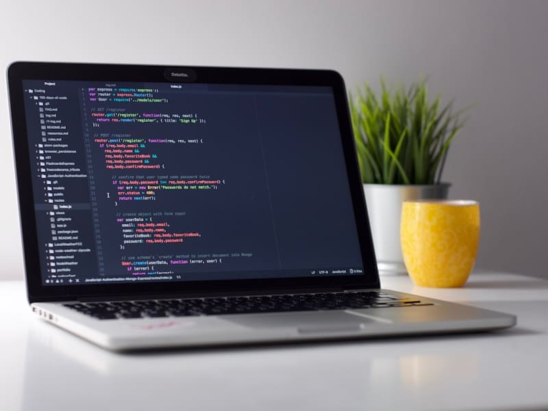 Software developer working on a laptop during a focused build sprint